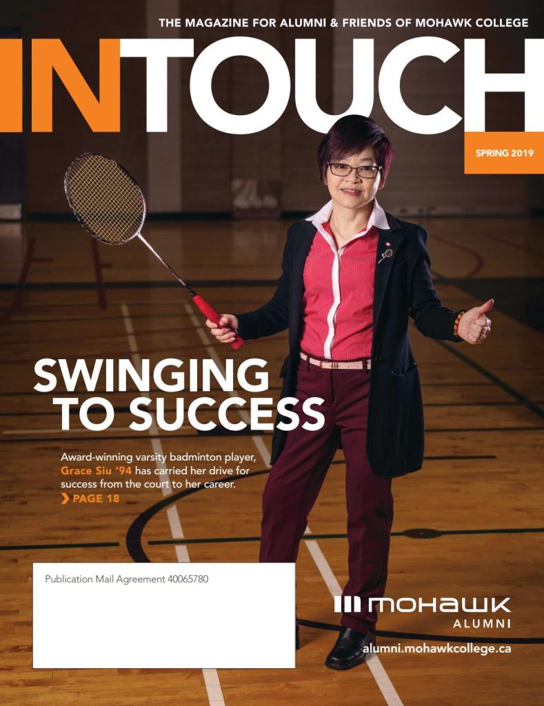 Cover of InTouch magazine. In Touch is written in bold across the top. Grace Siu is on the cover holding a badminton raquet on a court wearing business clothes.